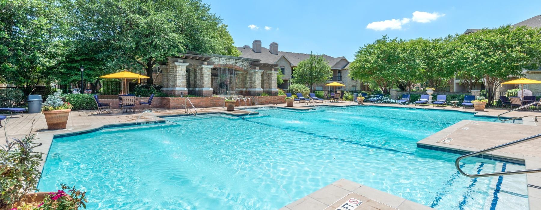 a swimming pool with a building in the background