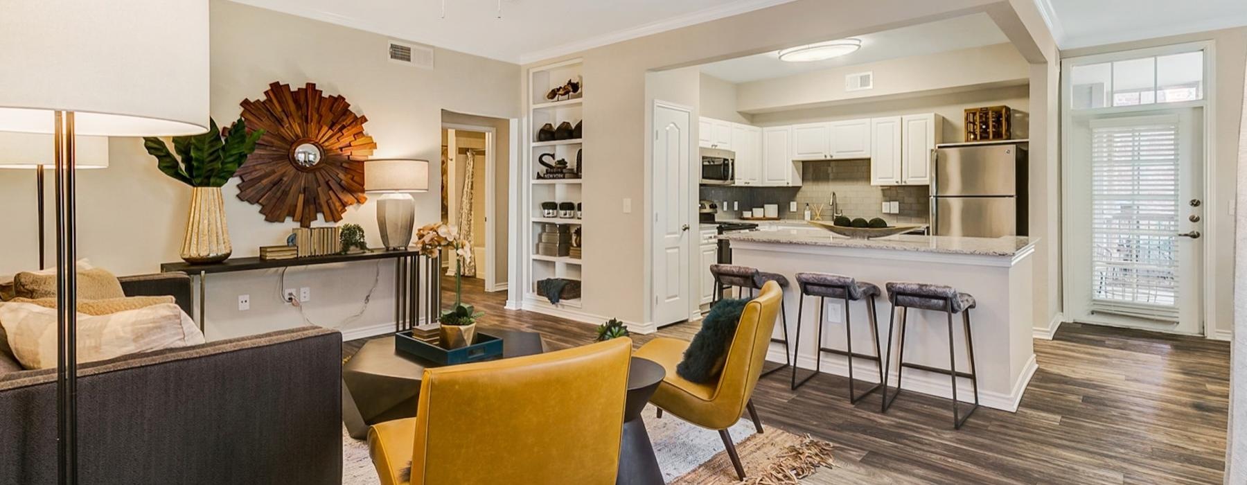 a living room with a table and chairs