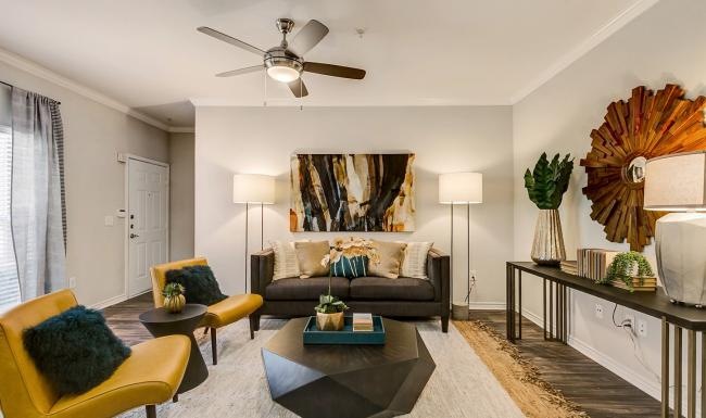 a living room with a large fan