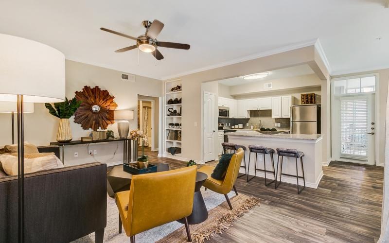 a living room with a table and chairs